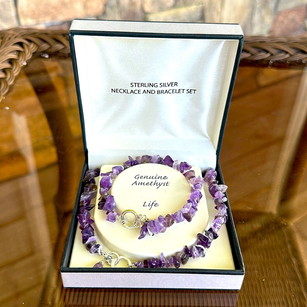 Brand new. Sterling Silver necklace and bracelet set genuine amethyst.